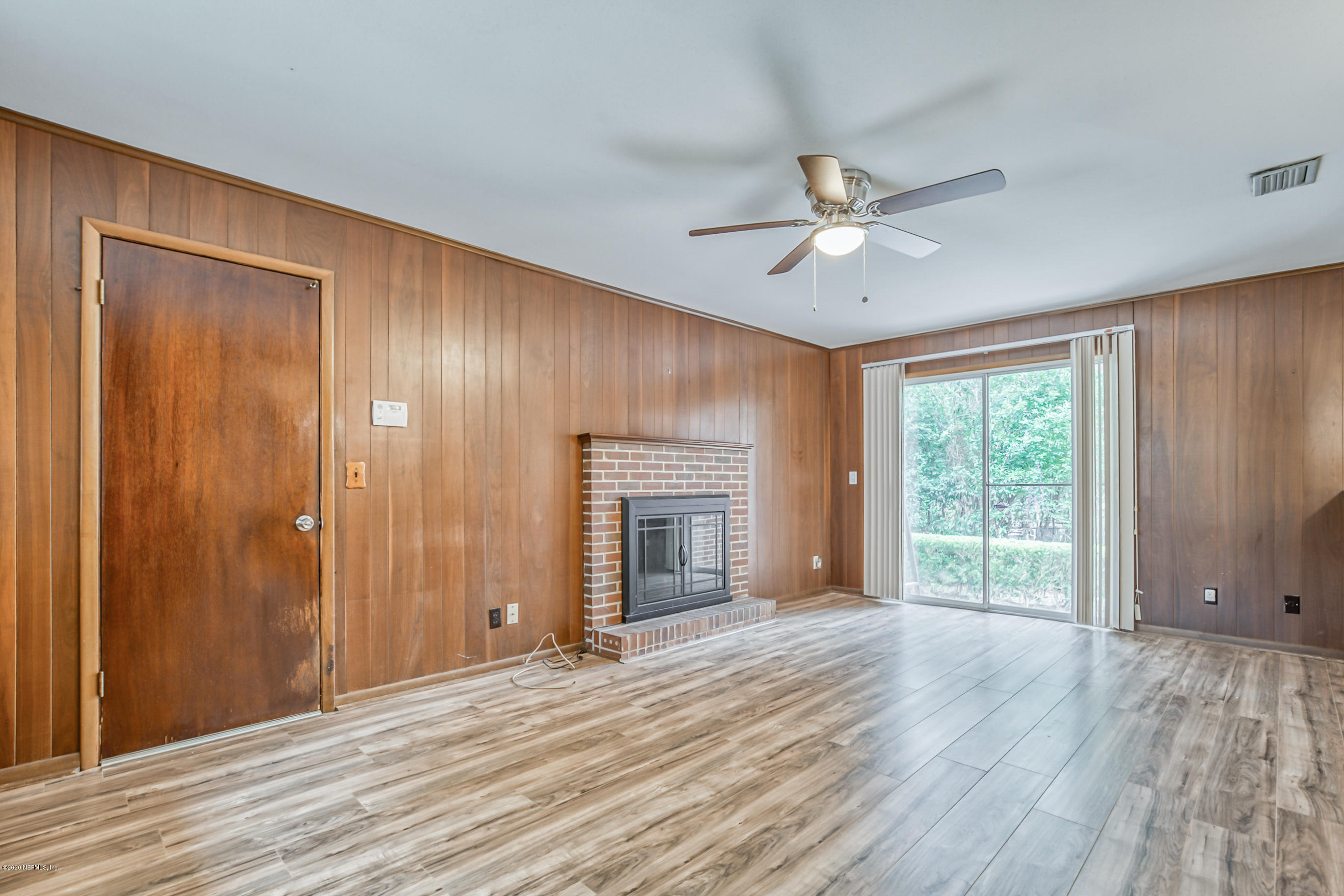 1305 Timber Lane Jacksonville, FL 32211 - Photo 31 of 58 a view of an empty room with a window and wooden floor