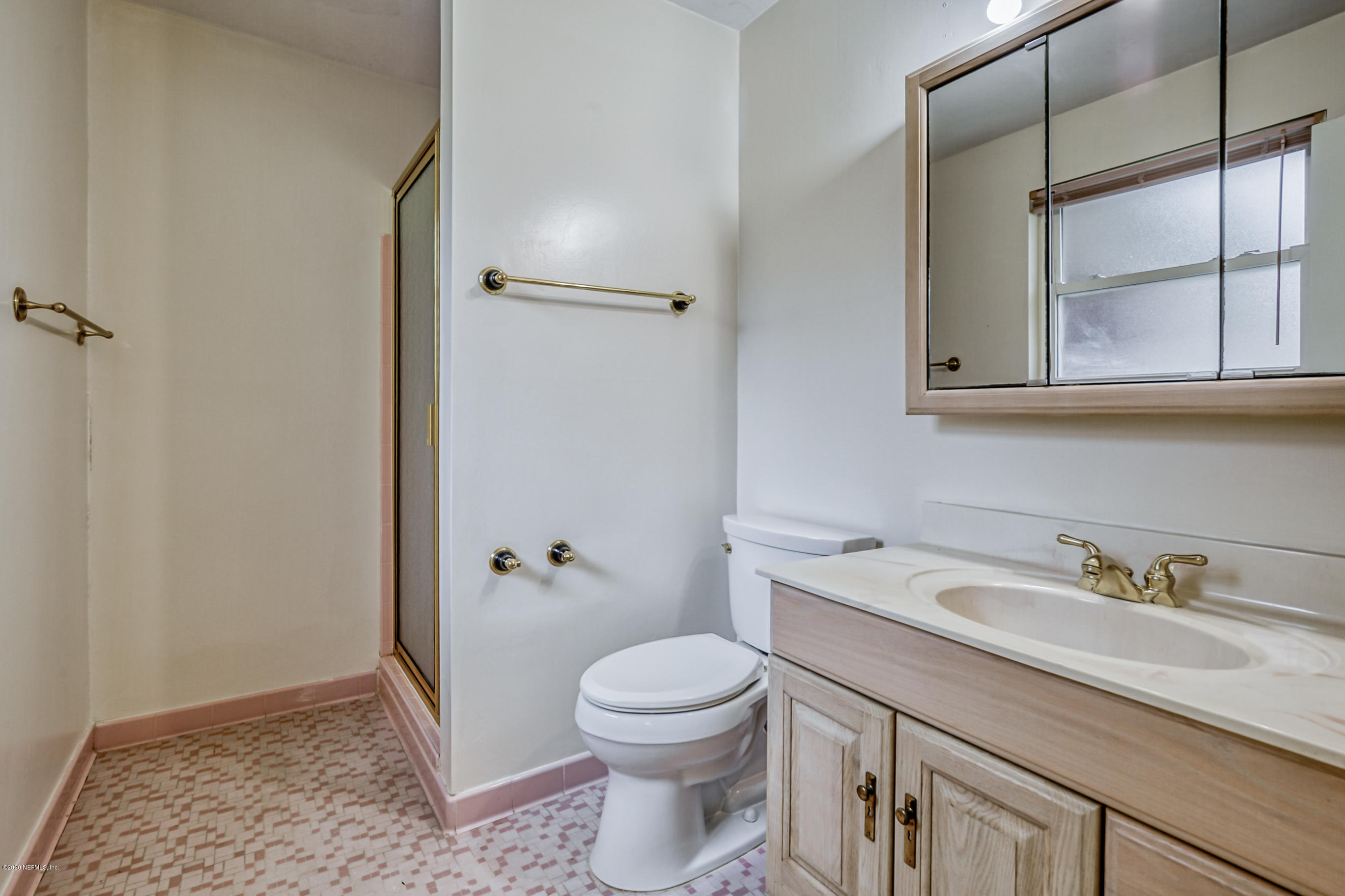 1305 Timber Lane Jacksonville, FL 32211 - Photo 34 of 58 a bathroom with a sink a toilet and shower