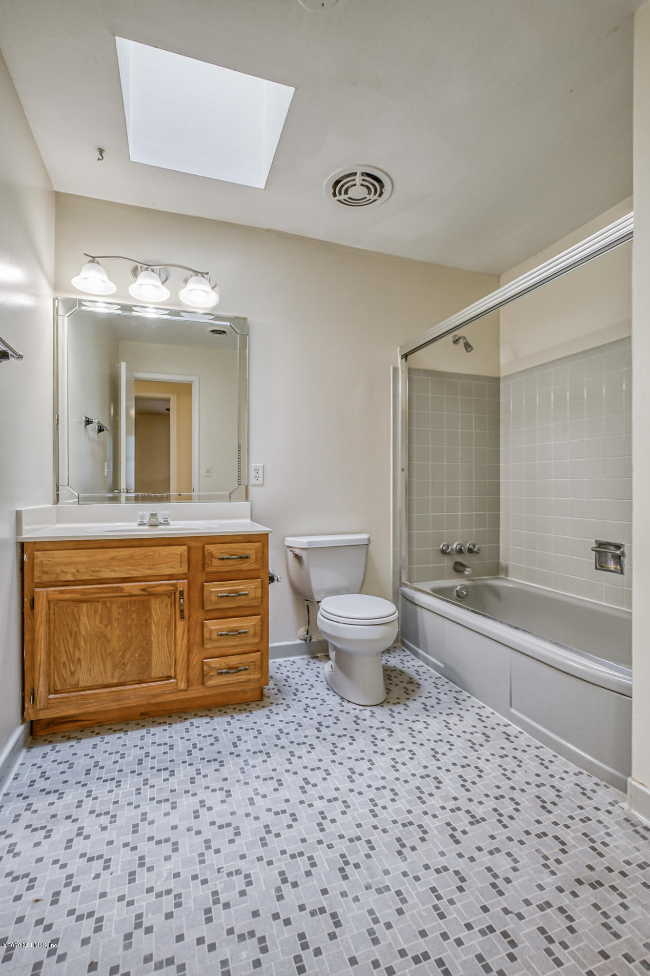 1305 Timber Lane Jacksonville, FL 32211 - Photo 39 of 58 a bathroom with a granite countertop sink a toilet and shower