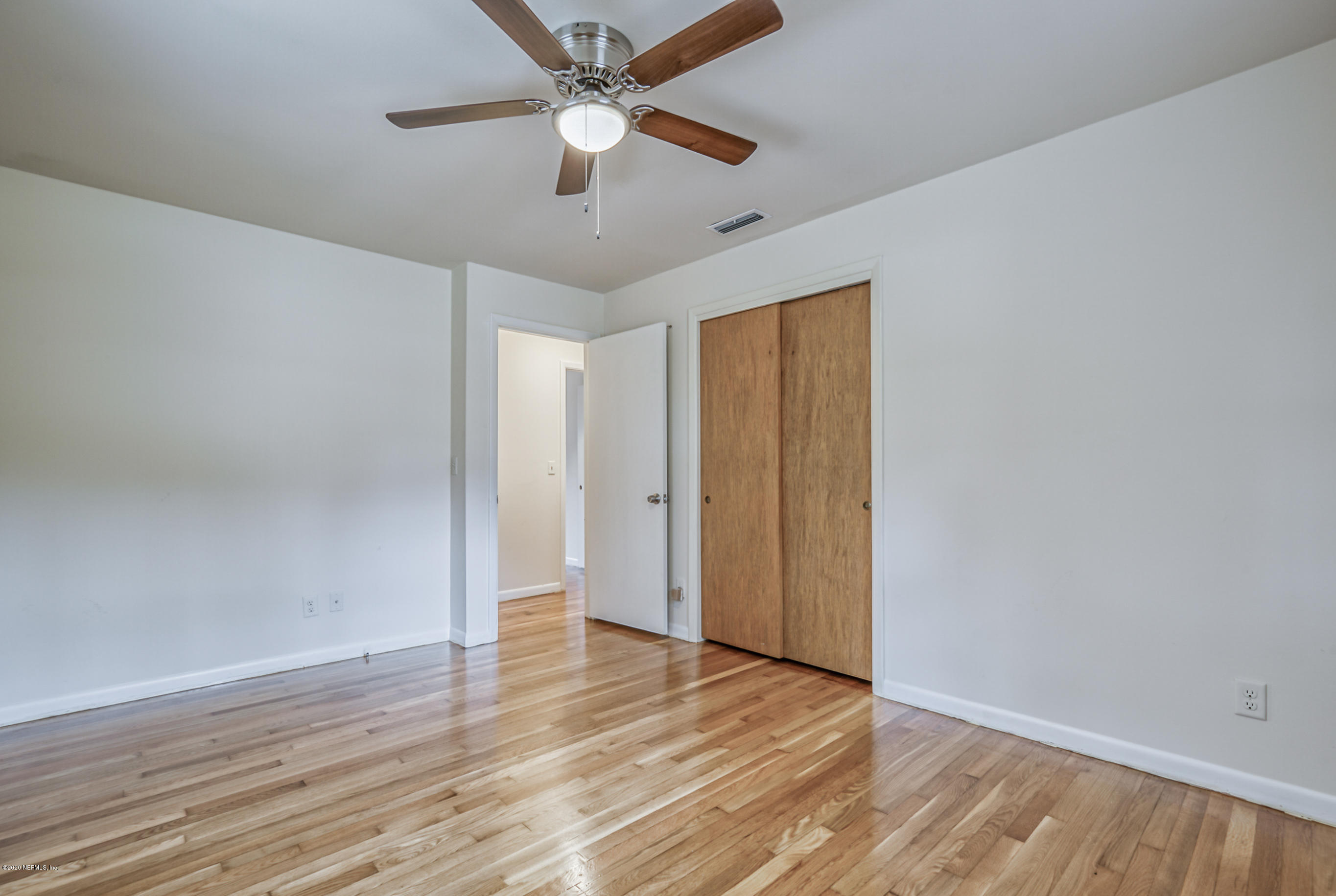 1305 Timber Lane Jacksonville, FL 32211 - Photo 41 of 58 a view of an empty room with wooden floor