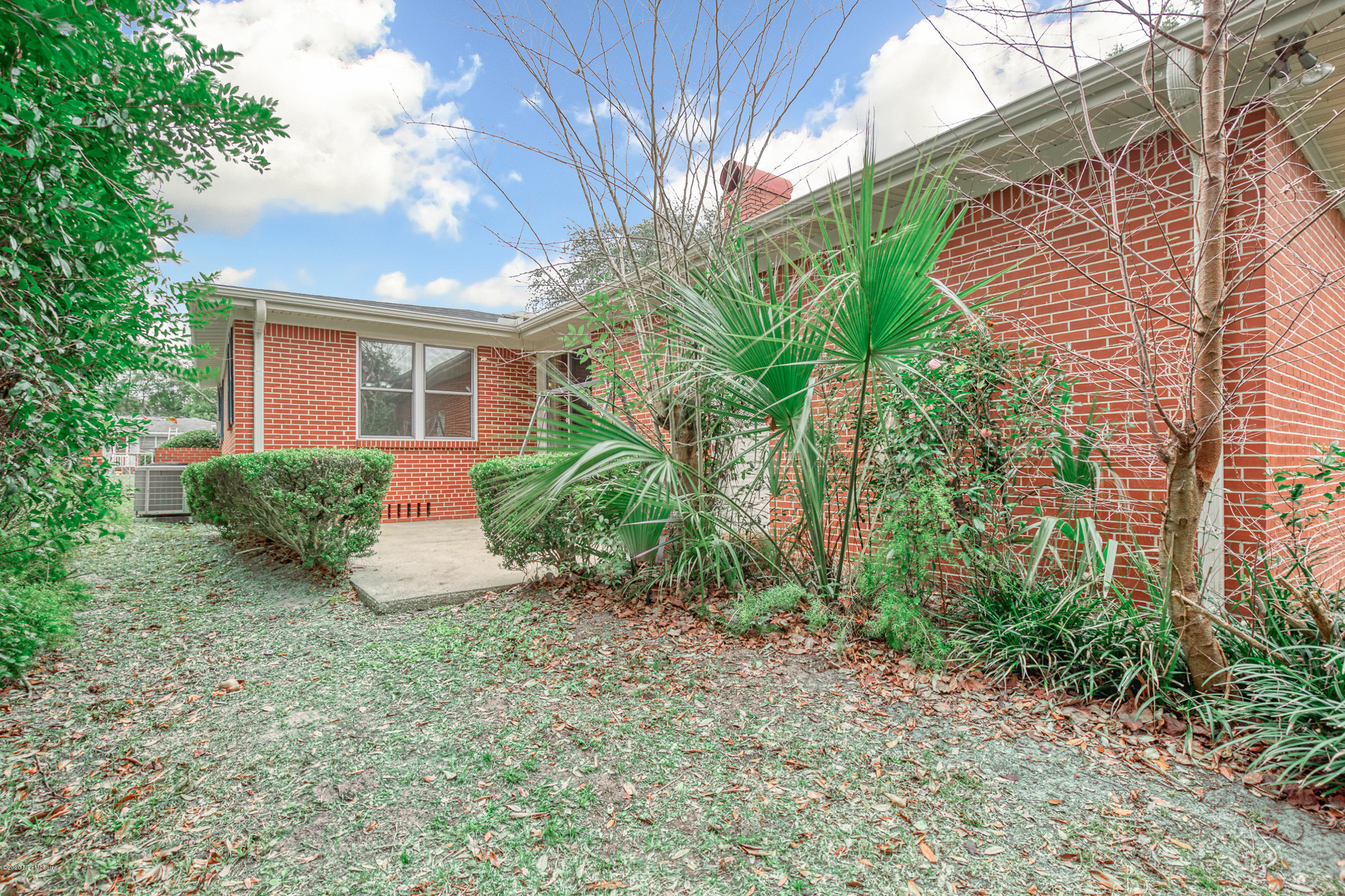 1305 Timber Lane Jacksonville, FL 32211 - Photo 51 of 58 a view of a house with a yard