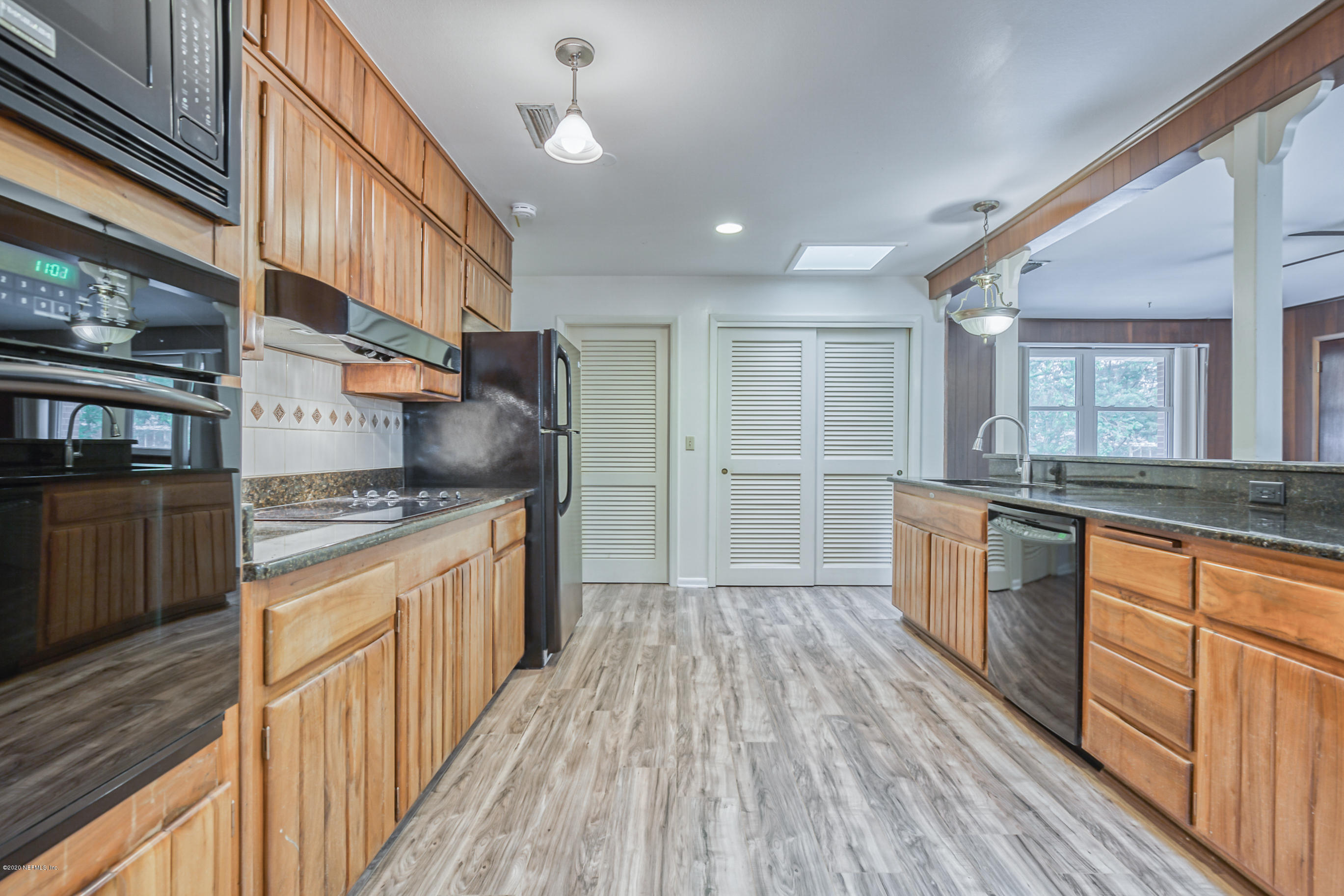 1305 Timber Lane Jacksonville, FL 32211 - Photo 7 of 58 a kitchen with stainless steel appliances granite countertop a stove and a sink