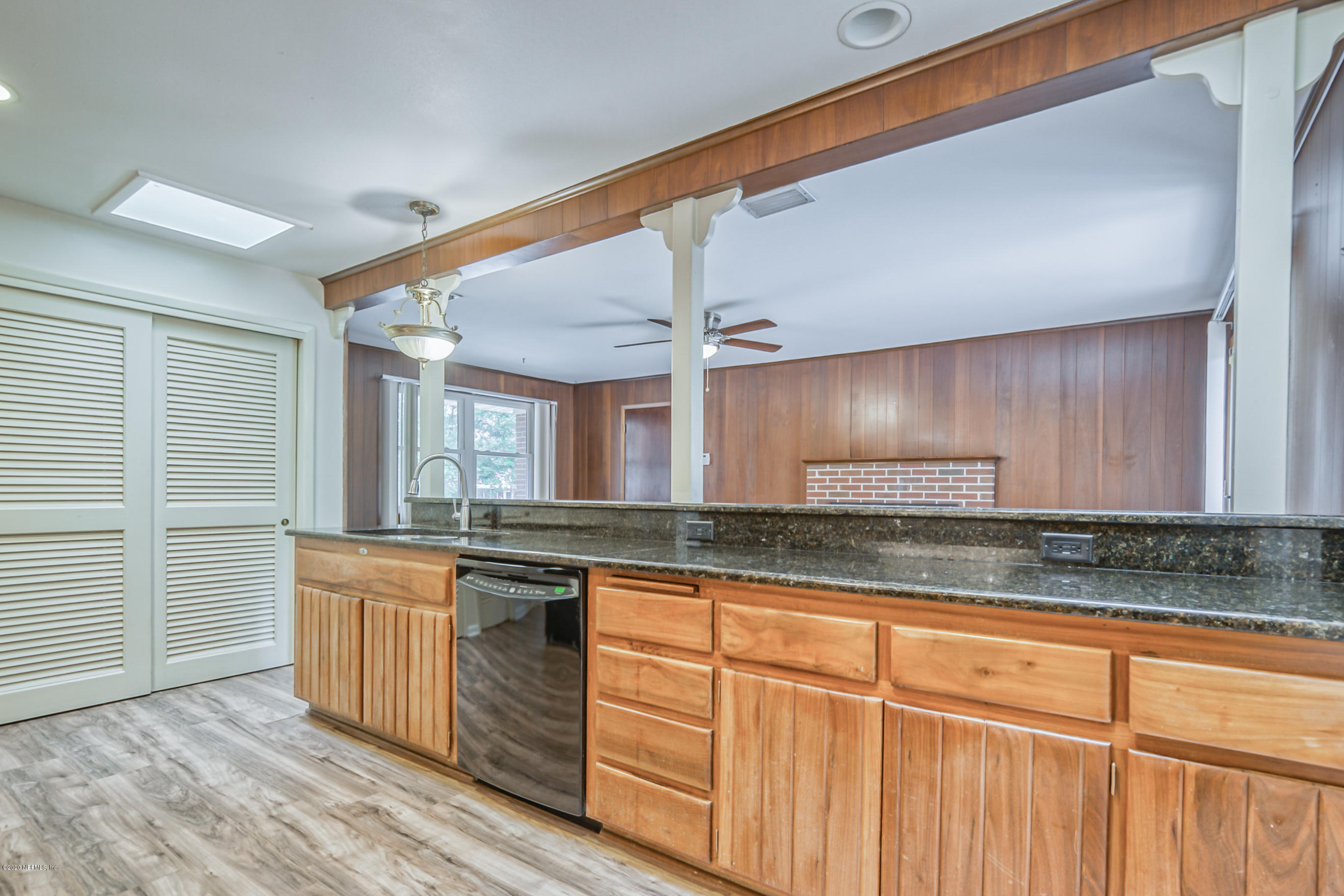 1305 Timber Lane Jacksonville, FL 32211 - Photo 9 of 58 a kitchen with granite countertop a sink and cabinets
