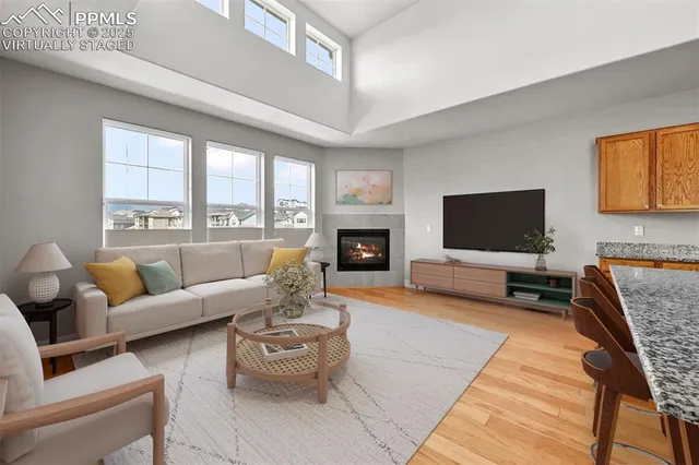 a living room with fireplace furniture and a flat screen tv