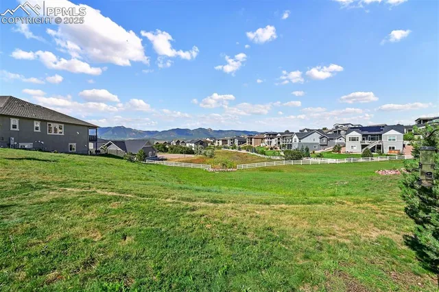 a view of building with outdoor space and seating
