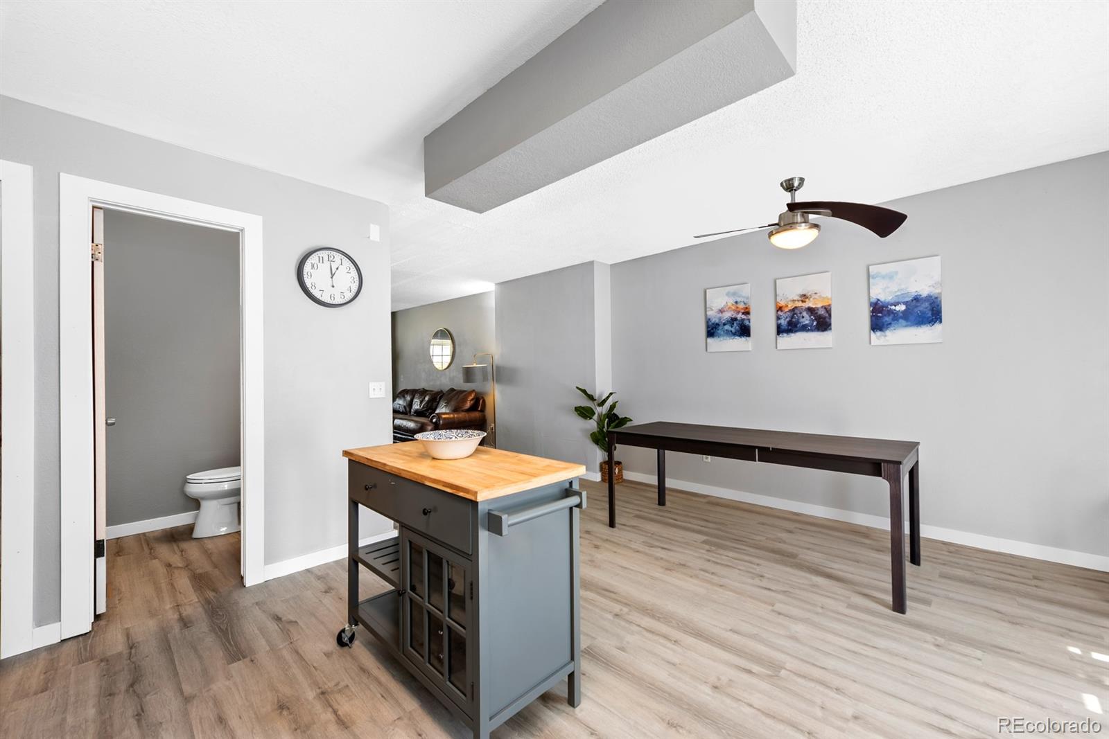 19927 Briarwood Court Parker, CO 80138 - Photo 15 of 29 a view of a room with wooden floor and furniture