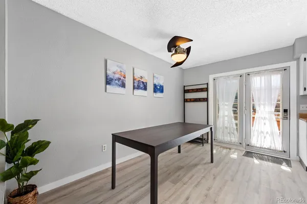 a view of work space with wooden floor and window