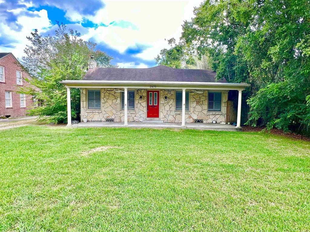 2475 Evalon Avenue Beaumont, TX 77702 - Photo 1 of 23 a front view of house with yard and green space