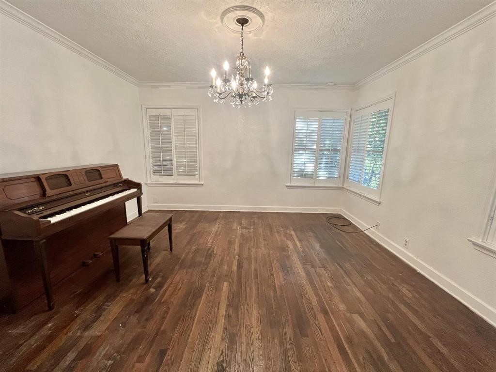 2475 Evalon Avenue Beaumont, TX 77702 - Photo 11 of 23 a living room with furniture and a chandelier