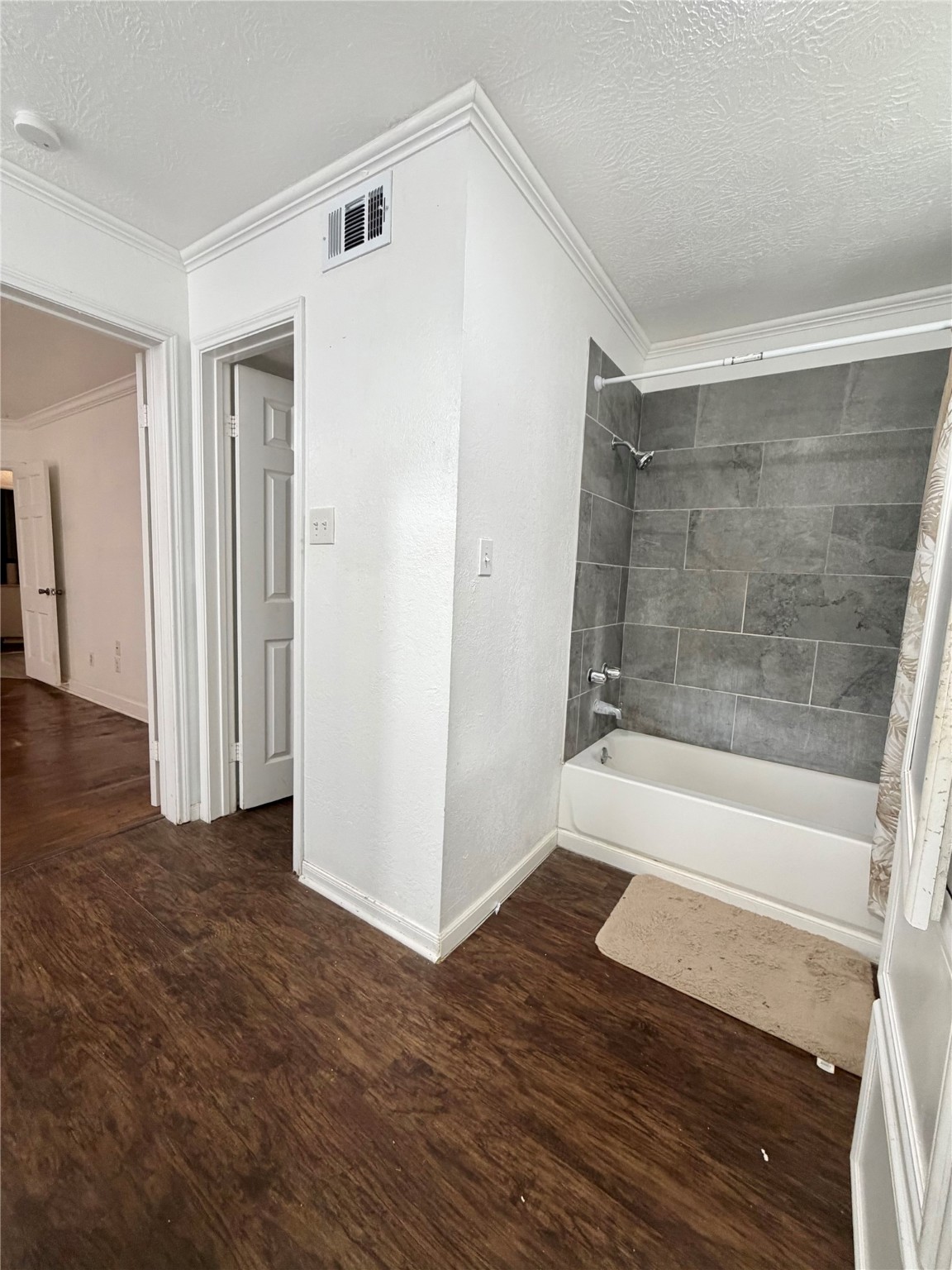 2475 Evalon Avenue Beaumont, TX 77702 - Photo 15 of 23 a bathroom with a bathtub and a shower