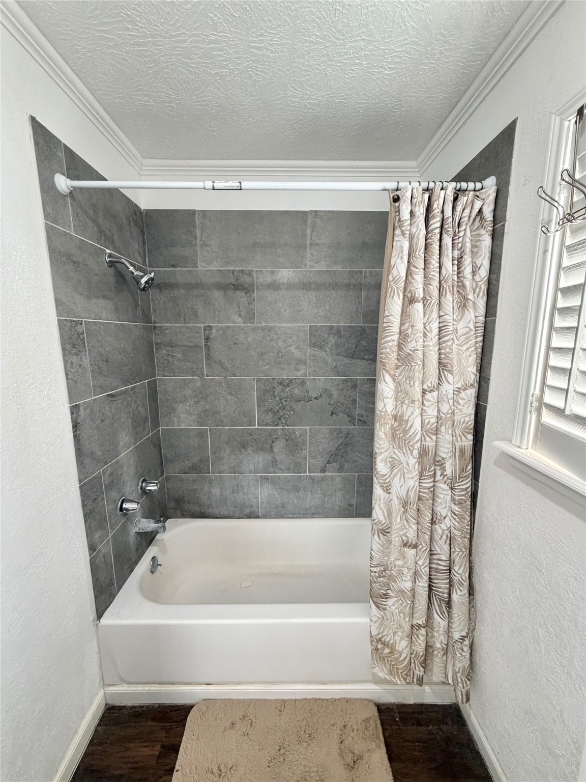 2475 Evalon Avenue Beaumont, TX 77702 - Photo 16 of 23 a bathroom with a bathtub and a shower