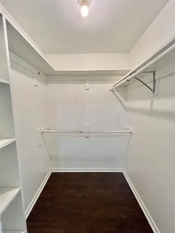 a view of an empty walk in closet