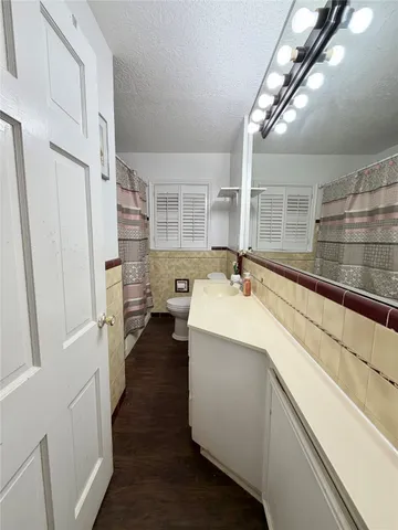 a kitchen with a sink and refrigerator