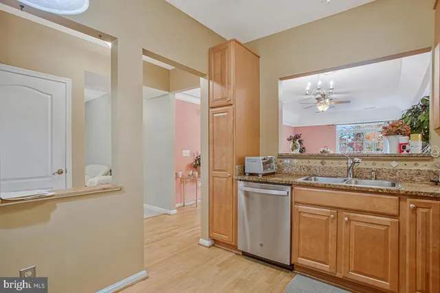a view of a bathroom with sink and shower