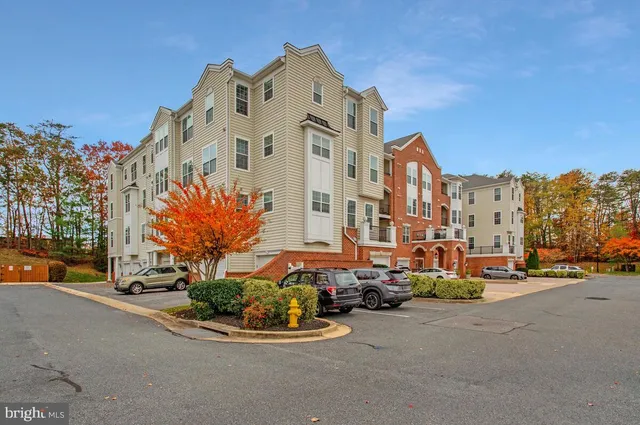 a big building with cars parked in front of it