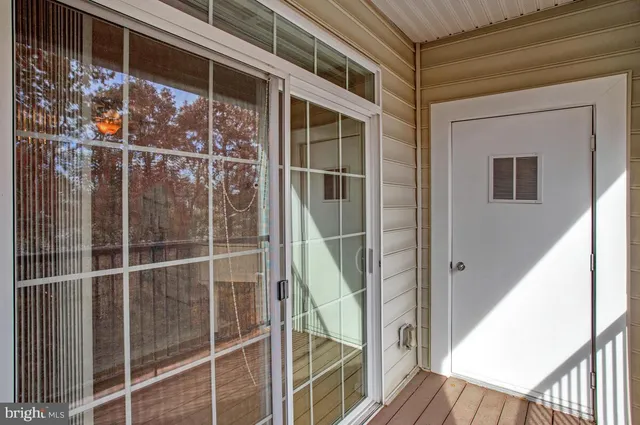 a view of a balcony with wooden floor