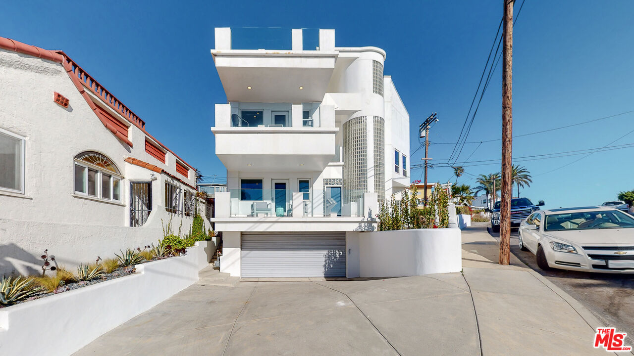 201 Waterview Street Playa del Rey, CA 90293 - Photo 1 of 54 a view of a white building among the cars front of house