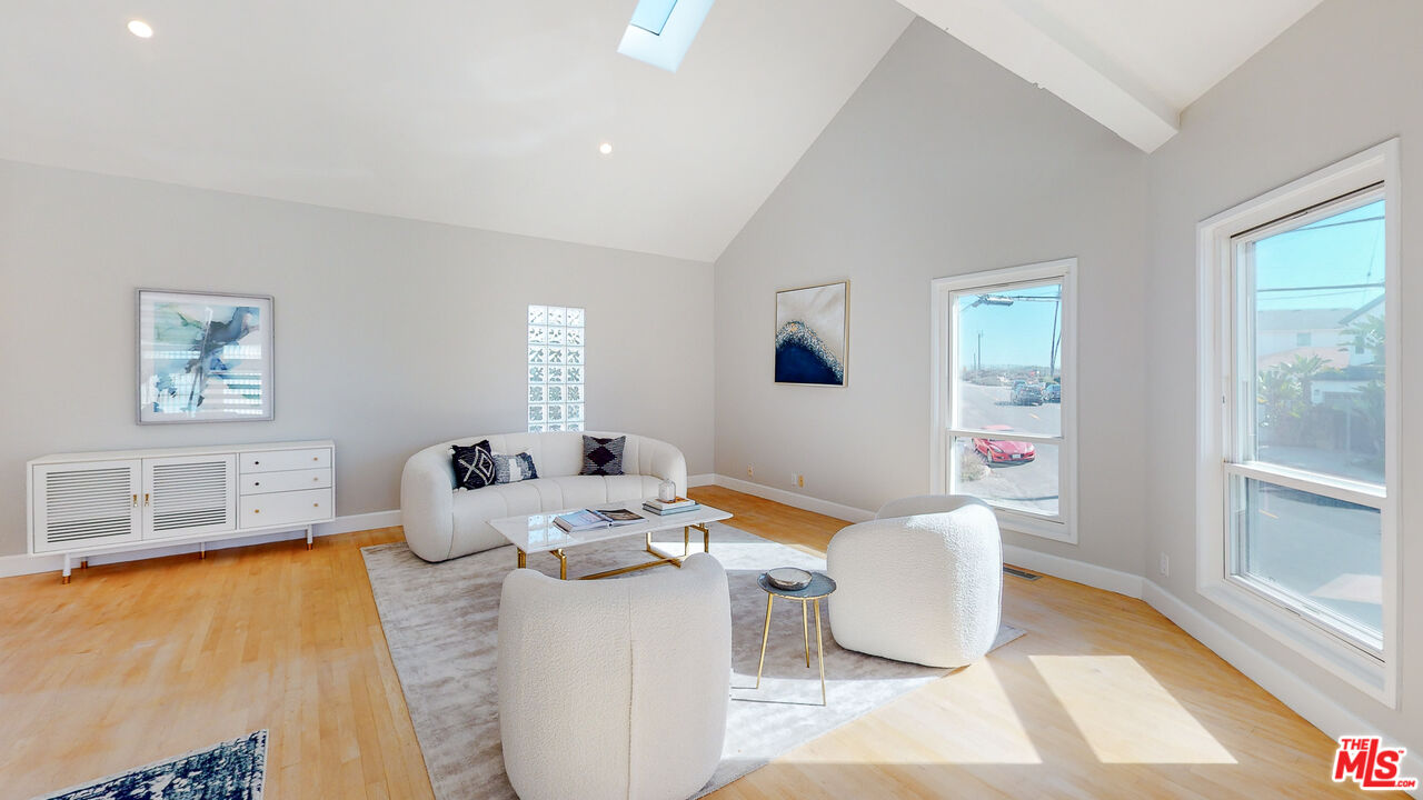 201 Waterview Street Playa del Rey, CA 90293 - Photo 11 of 54 a living room with furniture and a window