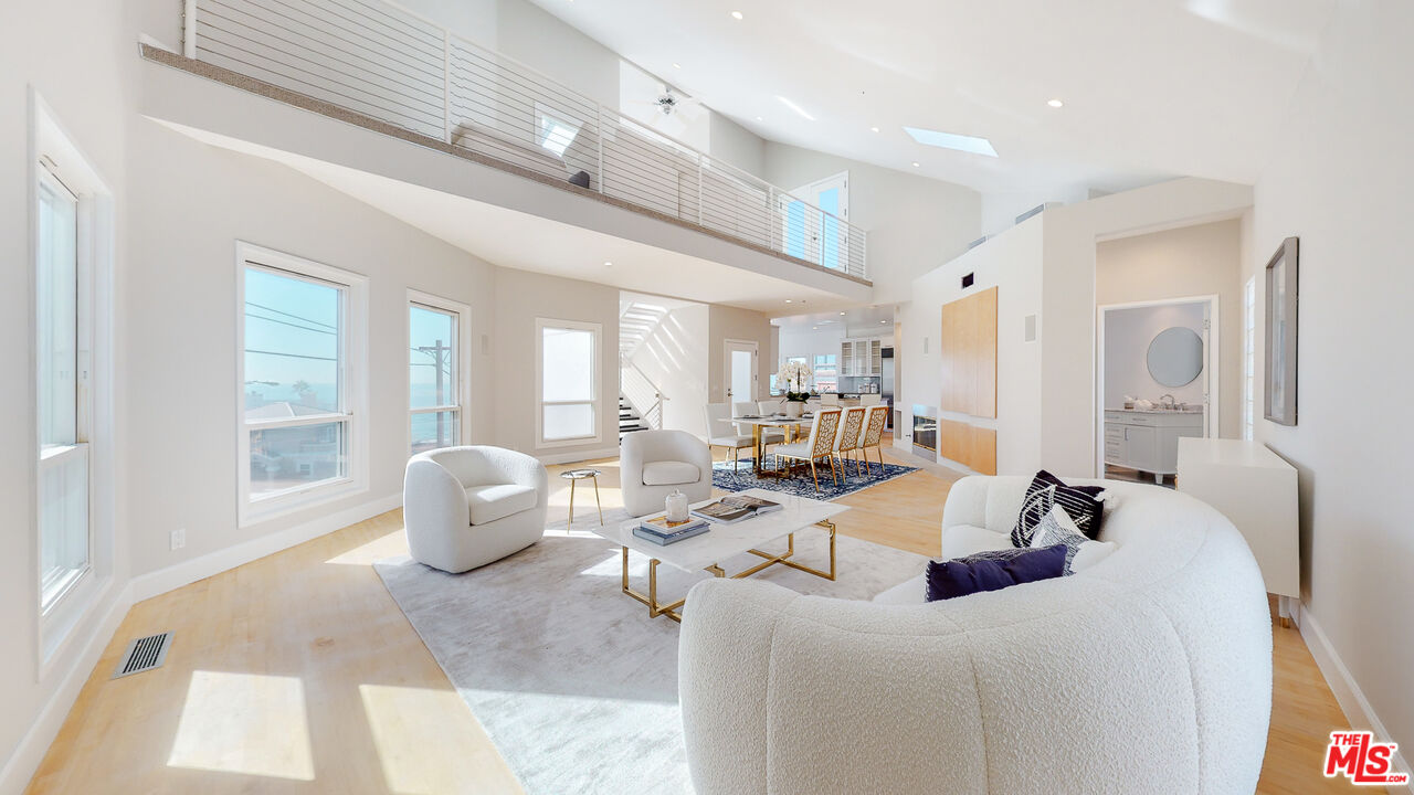 201 Waterview Street Playa del Rey, CA 90293 - Photo 12 of 54 a view of a dining room with furniture and a large window