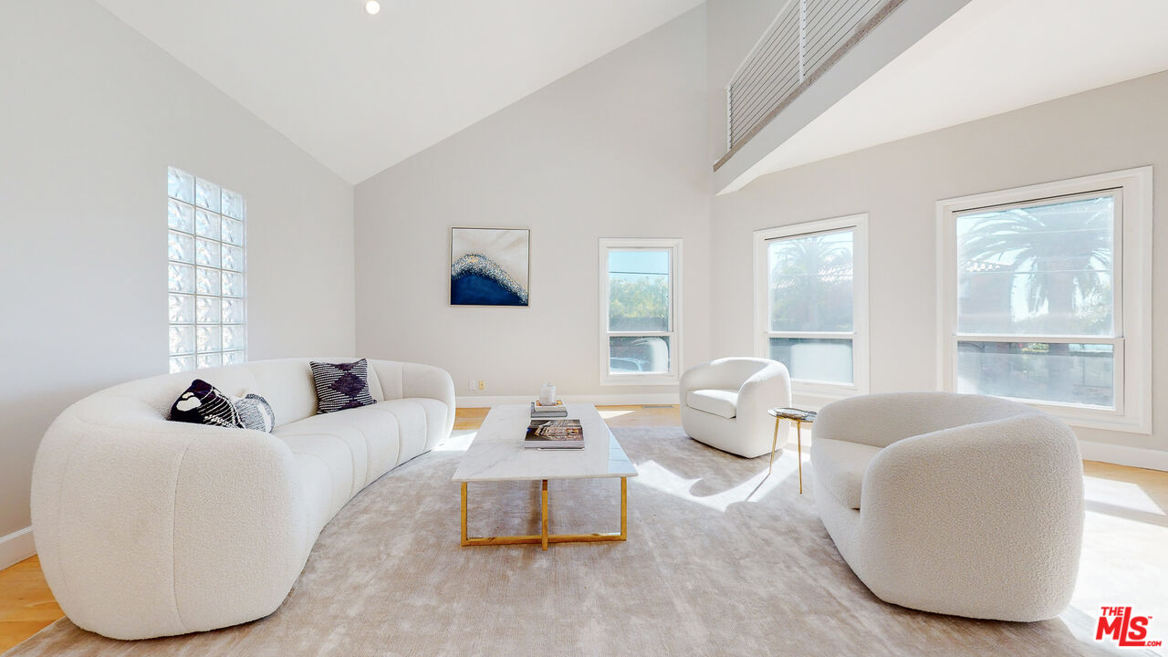 201 Waterview Street Playa del Rey, CA 90293 - Photo 15 of 54 a living room with furniture and a large window