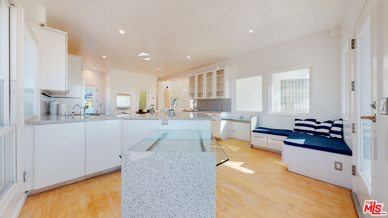 201 Waterview Street Playa del Rey, CA 90293 - Photo 24 of 54 a large white kitchen with lots of counter top space and stainless steel appliances