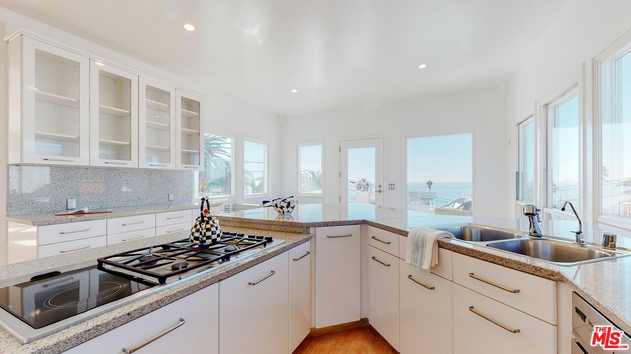 201 Waterview Street Playa del Rey, CA 90293 - Photo 25 of 54 a kitchen that has a sink and a stove