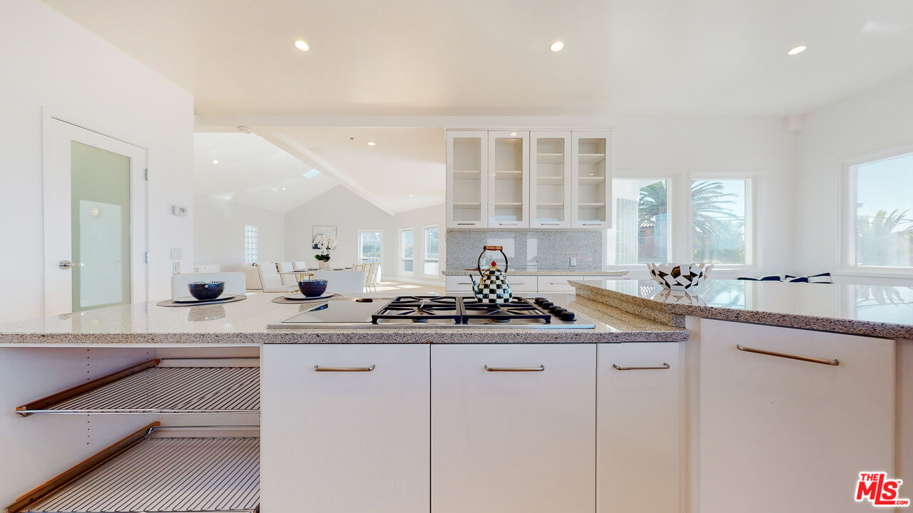 201 Waterview Street Playa del Rey, CA 90293 - Photo 26 of 54 a kitchen with a sink stove and cabinets