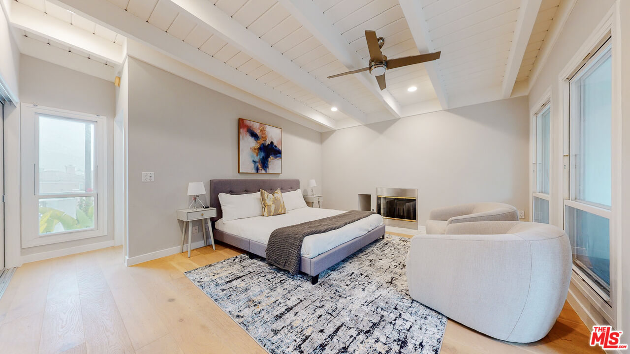 201 Waterview Street Playa del Rey, CA 90293 - Photo 35 of 54 a spacious bedroom with a bed a couch and a window