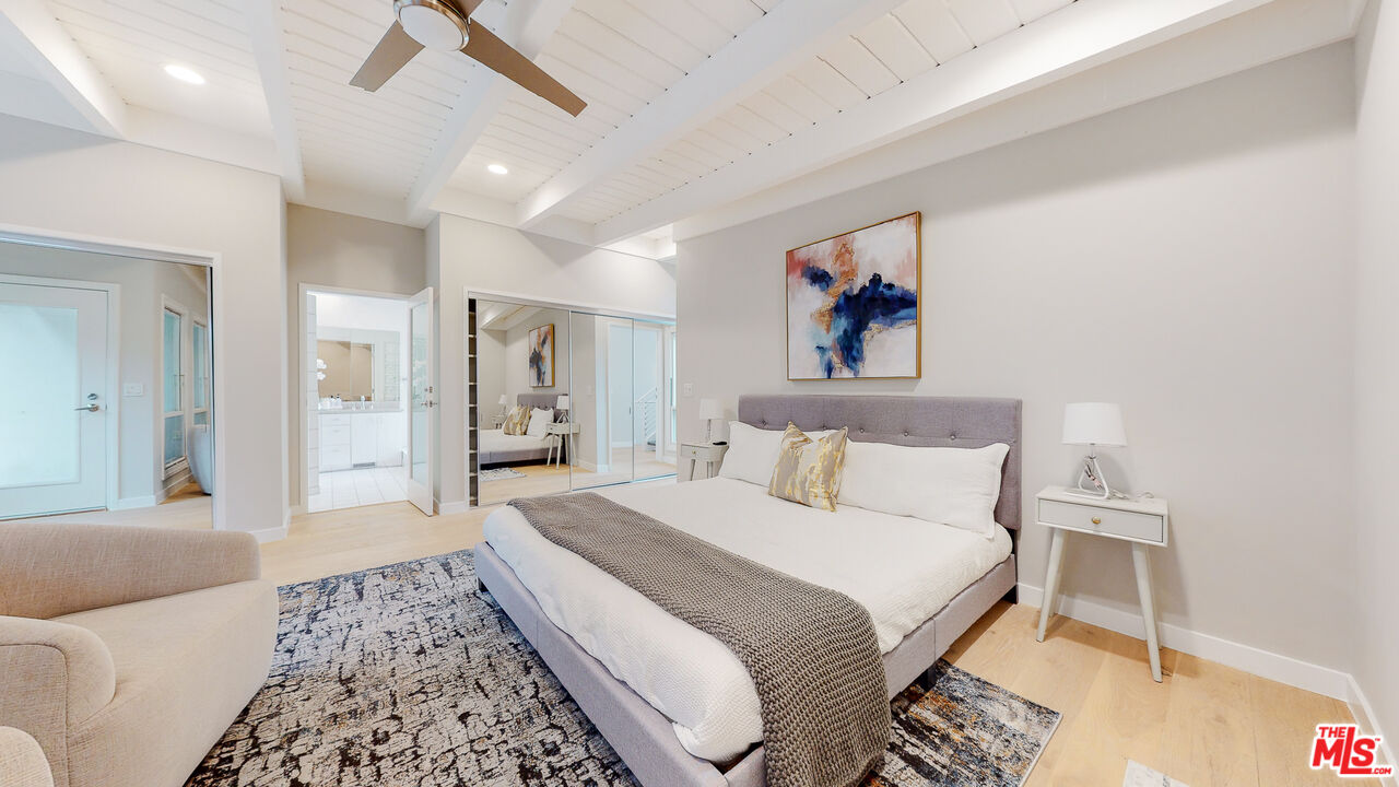 201 Waterview Street Playa del Rey, CA 90293 - Photo 38 of 54 a spacious bedroom with a large bed a chandelier and closet
