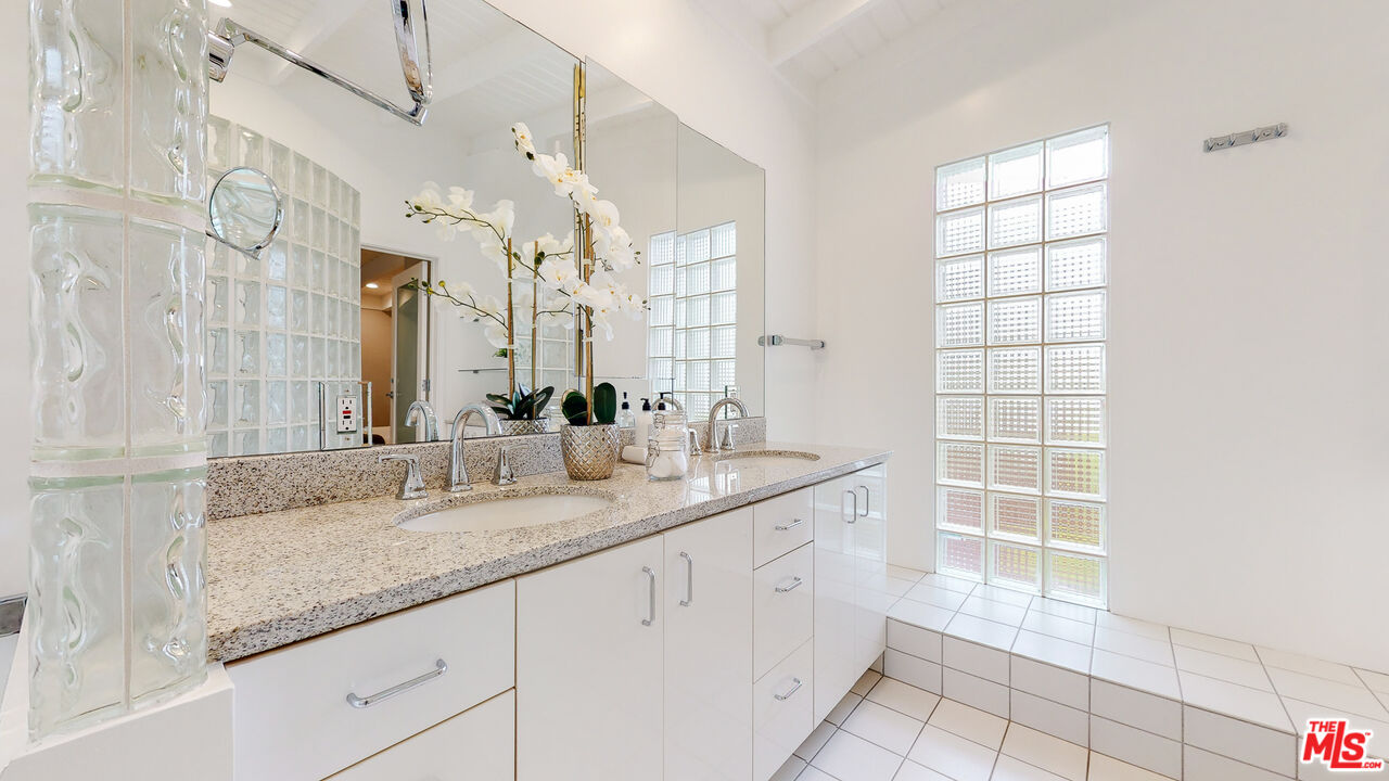 201 Waterview Street Playa del Rey, CA 90293 - Photo 41 of 54 a bathroom with a granite countertop sink mirror and double