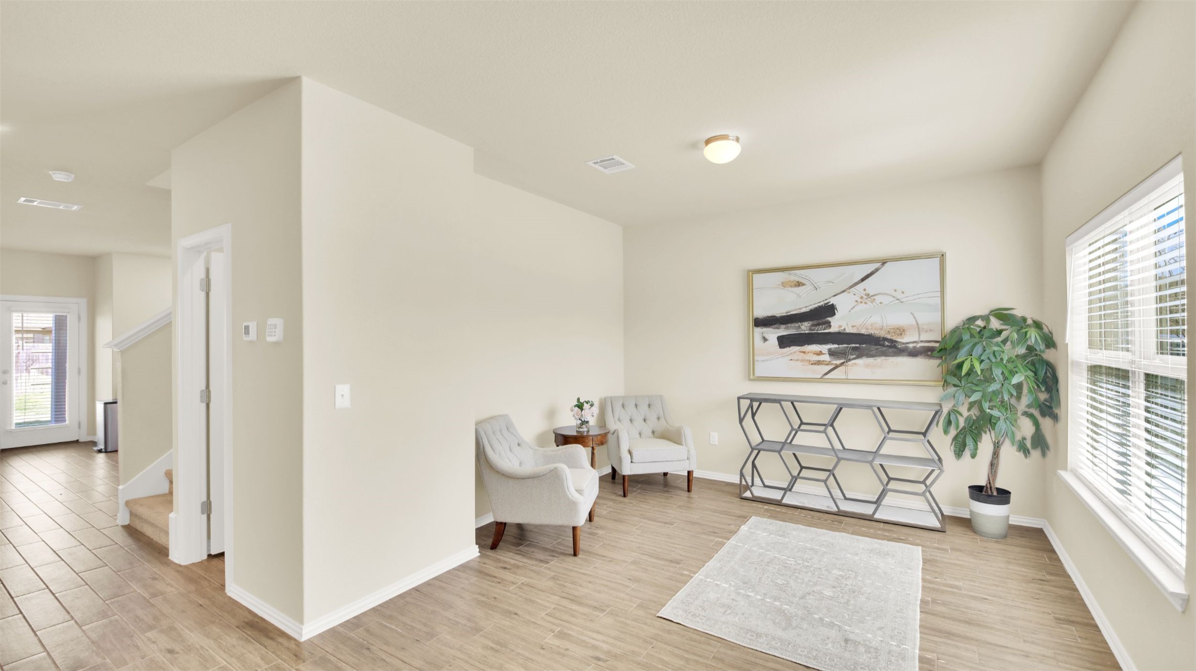 13716 Sugar Bush Path Manor, TX 78653 - Photo 10 of 37 Living area with light wood-style floors and baseboards