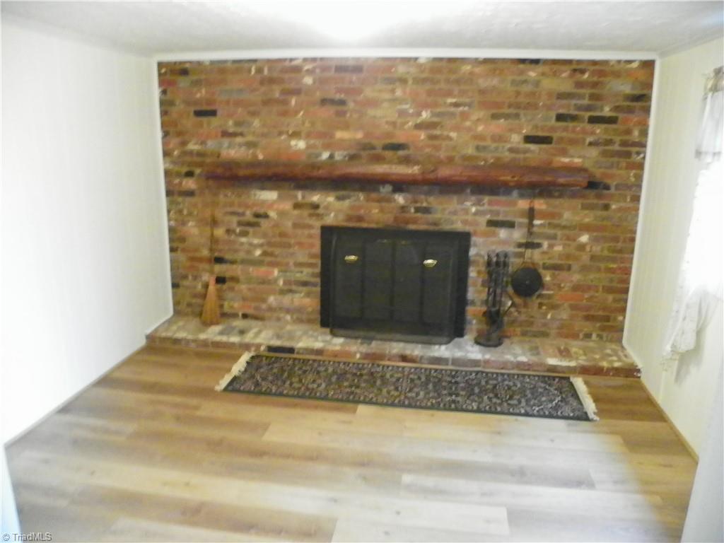 1036 Sink Farm Road Lexington, NC 27295 - Photo 7 of 10 Living room with fireplace and new flooring