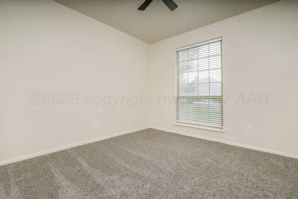 an empty room with a empty space and windows