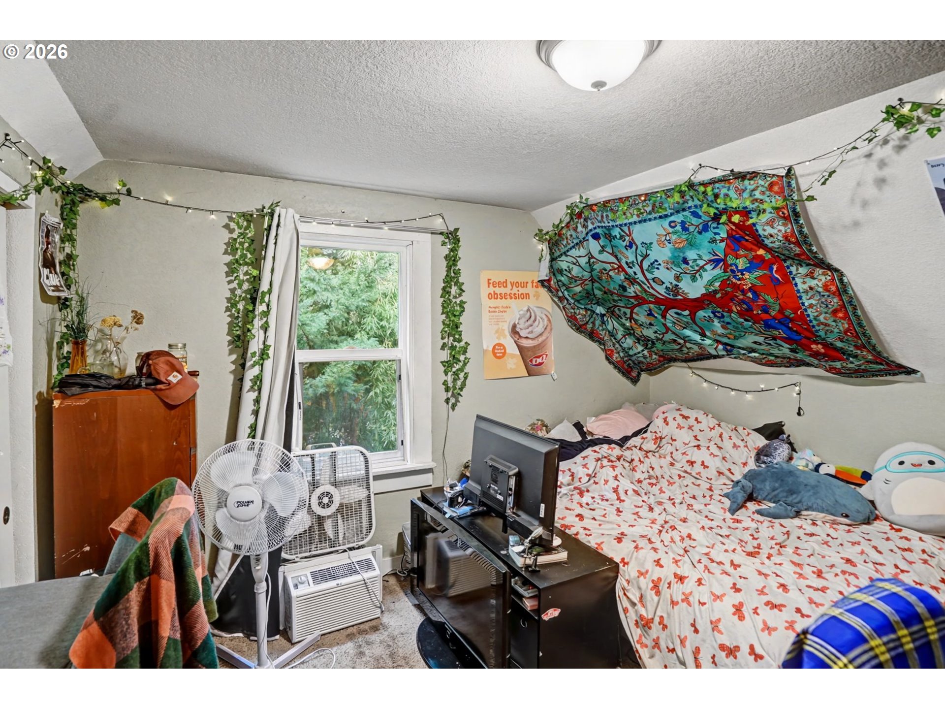 213 Mill Street Silverton, OR 97381 - Photo 18 of 25 a bedroom with a bed with wooden floor