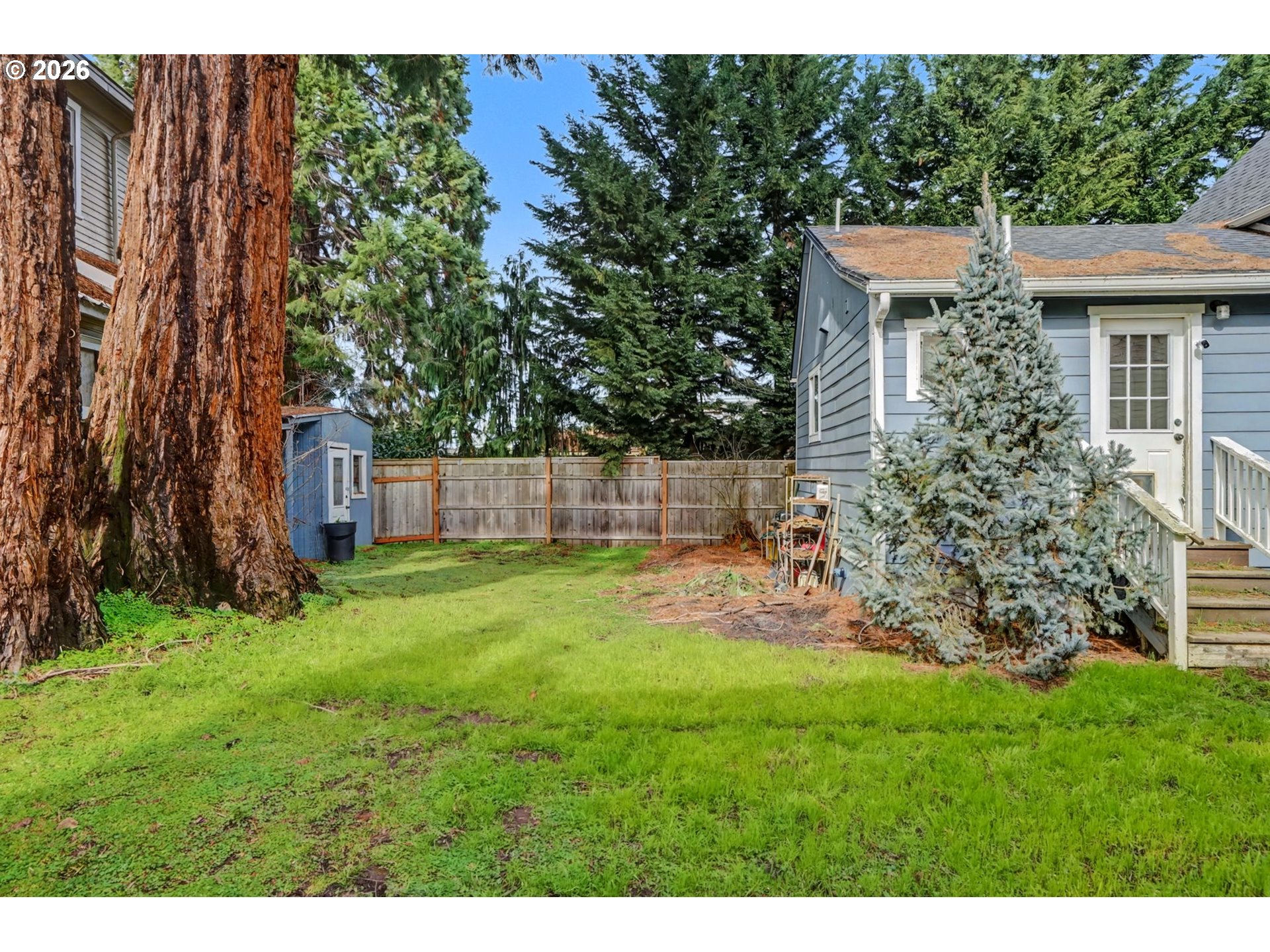213 Mill Street Silverton, OR 97381 - Photo 23 of 25 a view of a backyard with a garden and plants