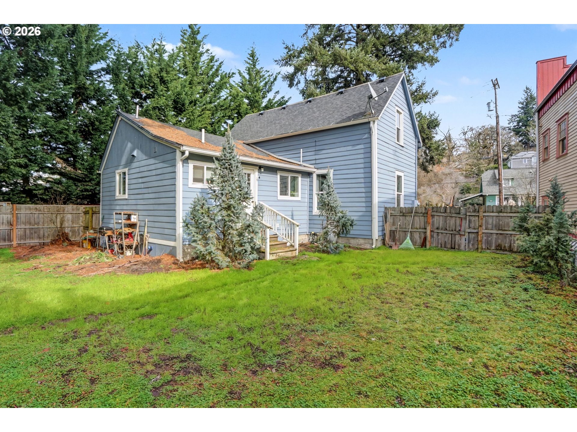 213 Mill Street Silverton, OR 97381 - Photo 25 of 25 a view of backyard of house with wooden deck and seating space