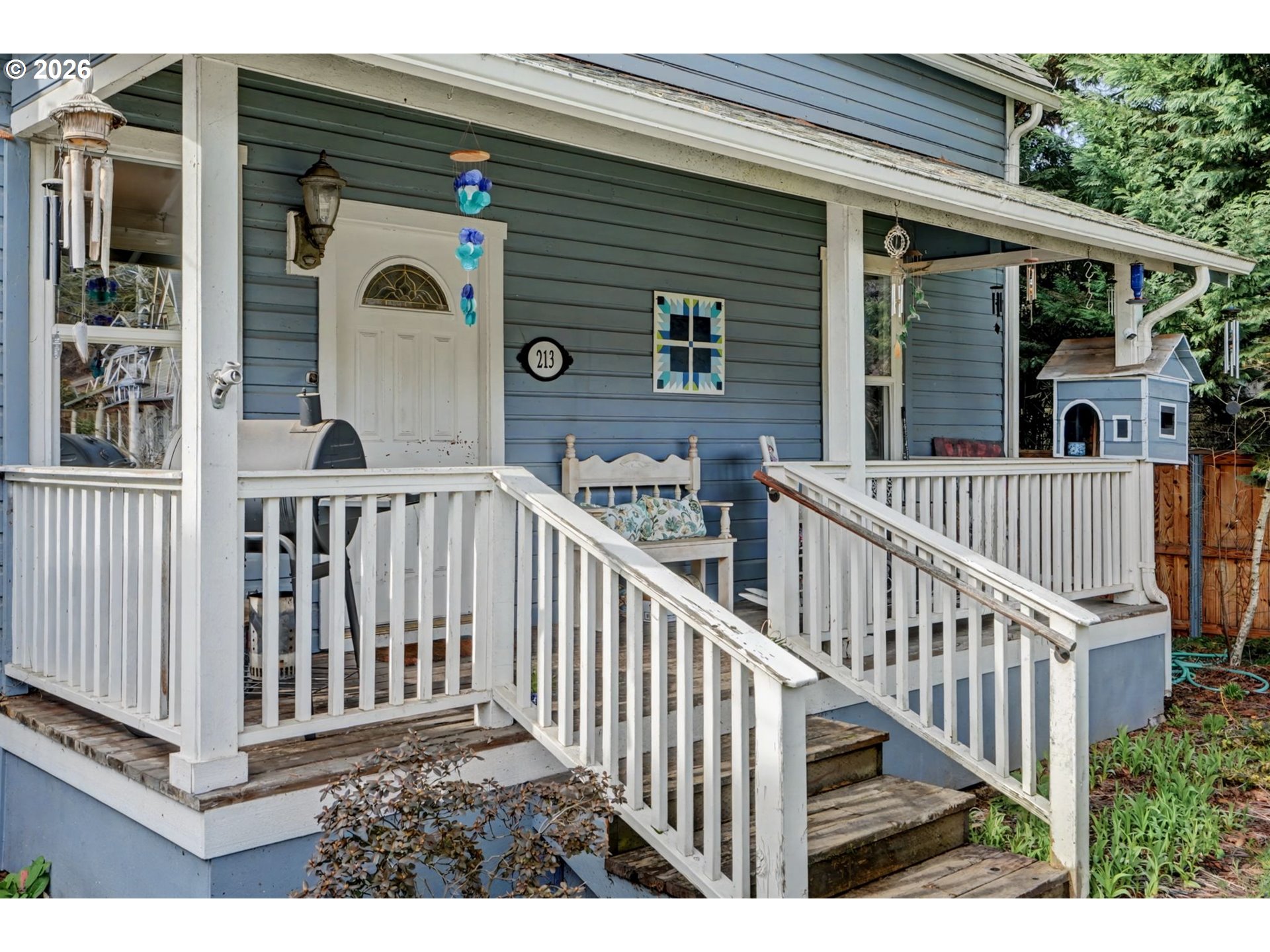 213 Mill Street Silverton, OR 97381 - Photo 4 of 25 a view of a house with porch and wooden floor