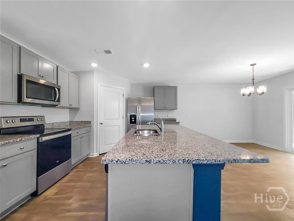 109 Barbados Circle Guyton, GA 31312 - Photo 15 of 46 KITCHEN WITH ISLAND/BREAKFAST BAR VIEW