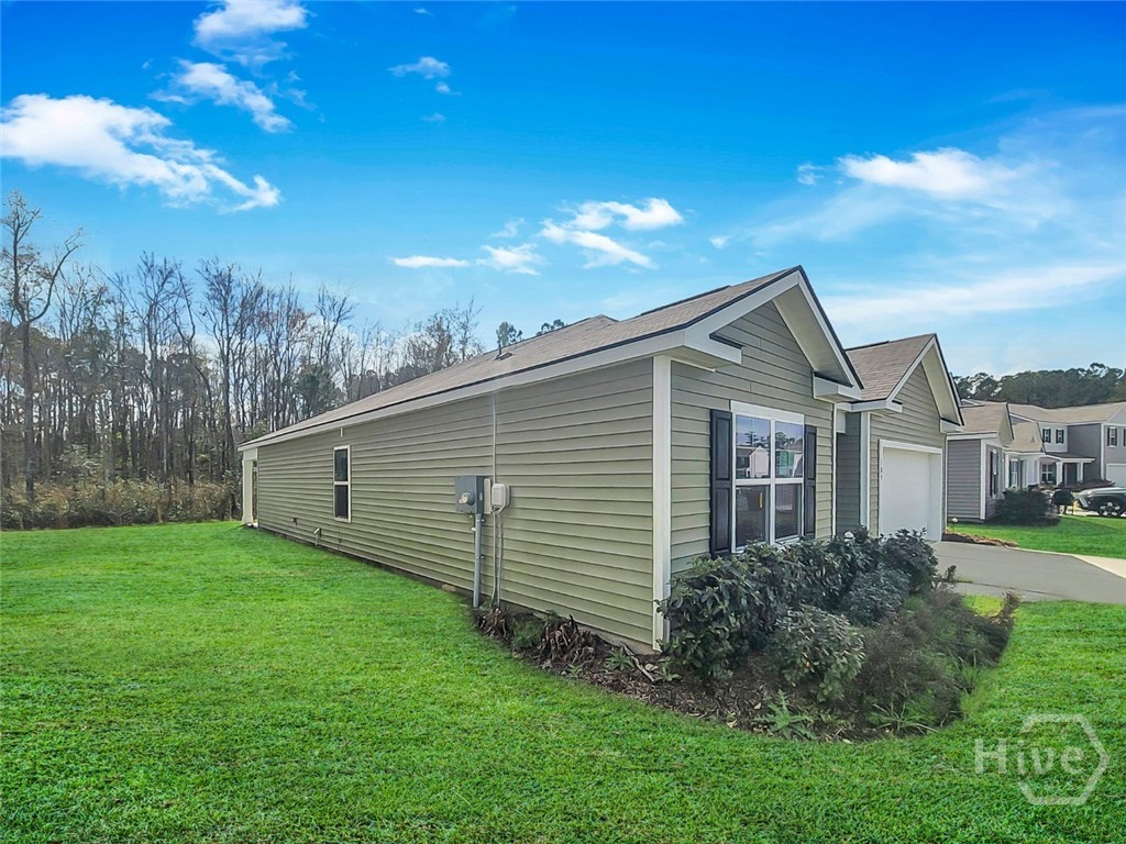 109 Barbados Circle Guyton, GA 31312 - Photo 4 of 46 SIDE VIEW