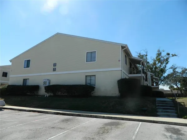 a view of house with yard