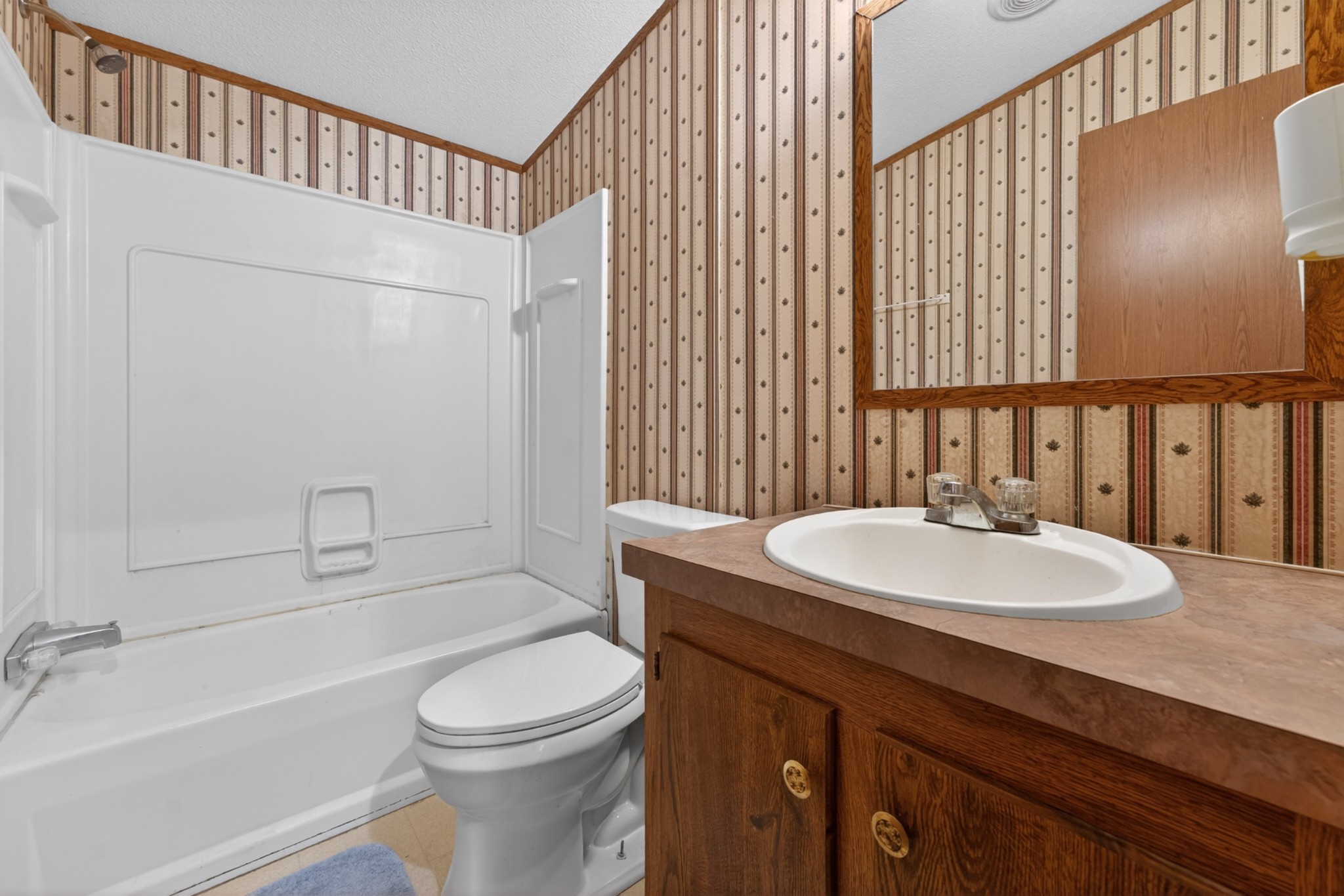 228 Shasteen Ridge Road Lynchburg, TN 37352 - Photo 20 of 53 a bathroom with a sink a toilet and shower