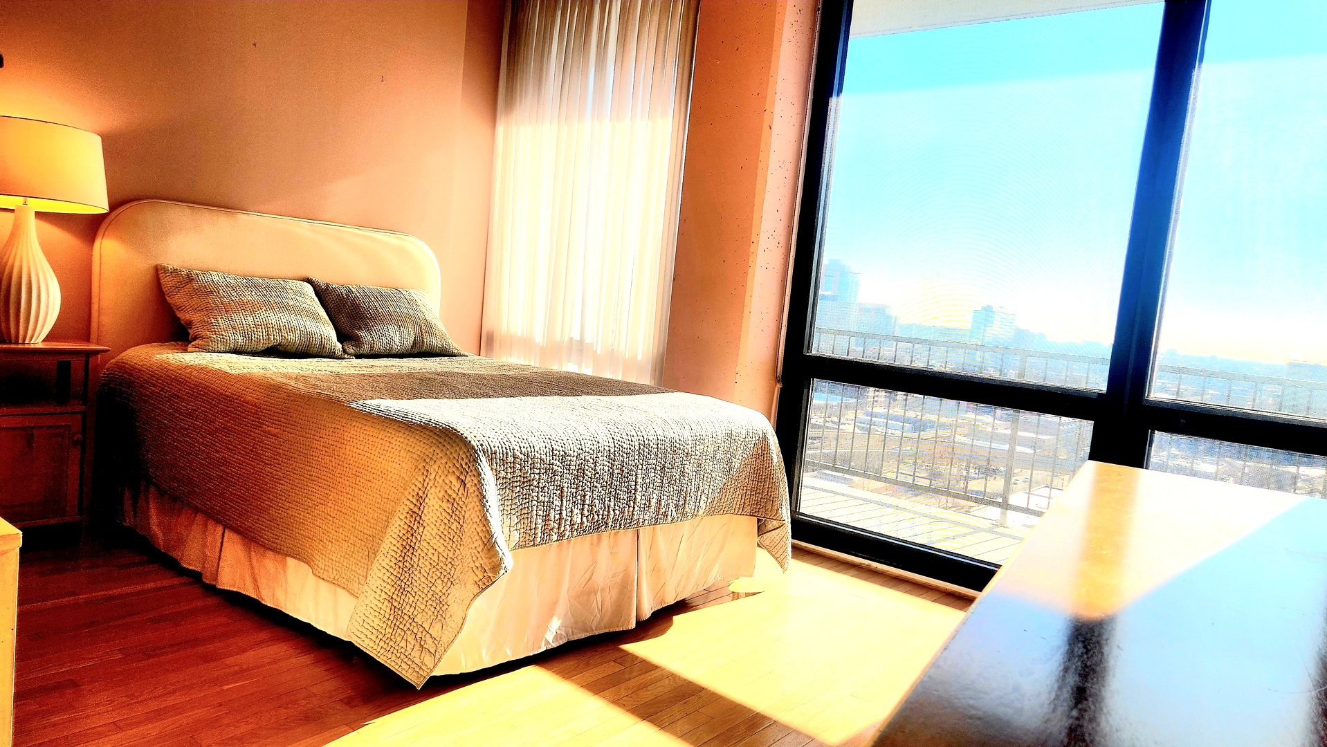 1530 South State Street, Unit 17R Chicago, IL 60605 - Photo 23 of 46 a bed sitting in a bedroom next to a window