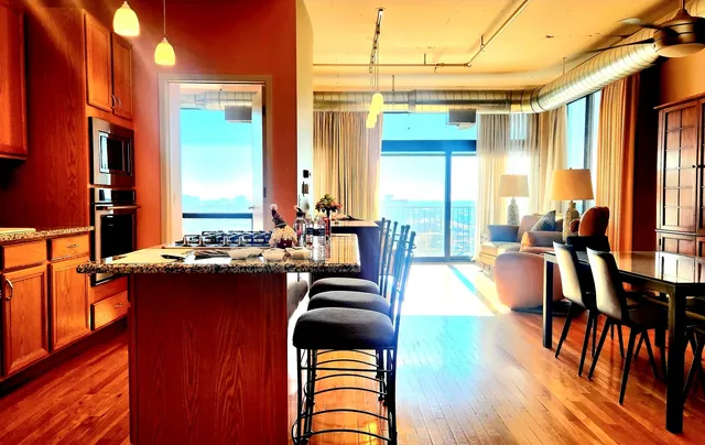 a bedroom with a bed and a refrigerator