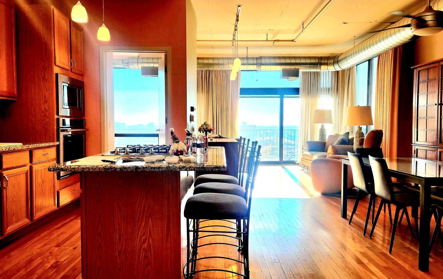 1530 South State Street, Unit 17R Chicago, IL 60605 - Photo 6 of 46 a view of a dining room with furniture window and wooden floor