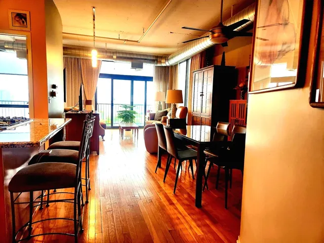 a view of a dining room with furniture and window