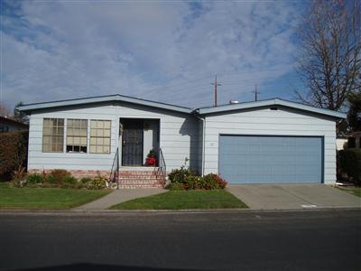 1945 Piner Road, Unit 70 Santa Rosa, CA 95403 - Photo 1 of 6 a front view of a house with a yard and garage