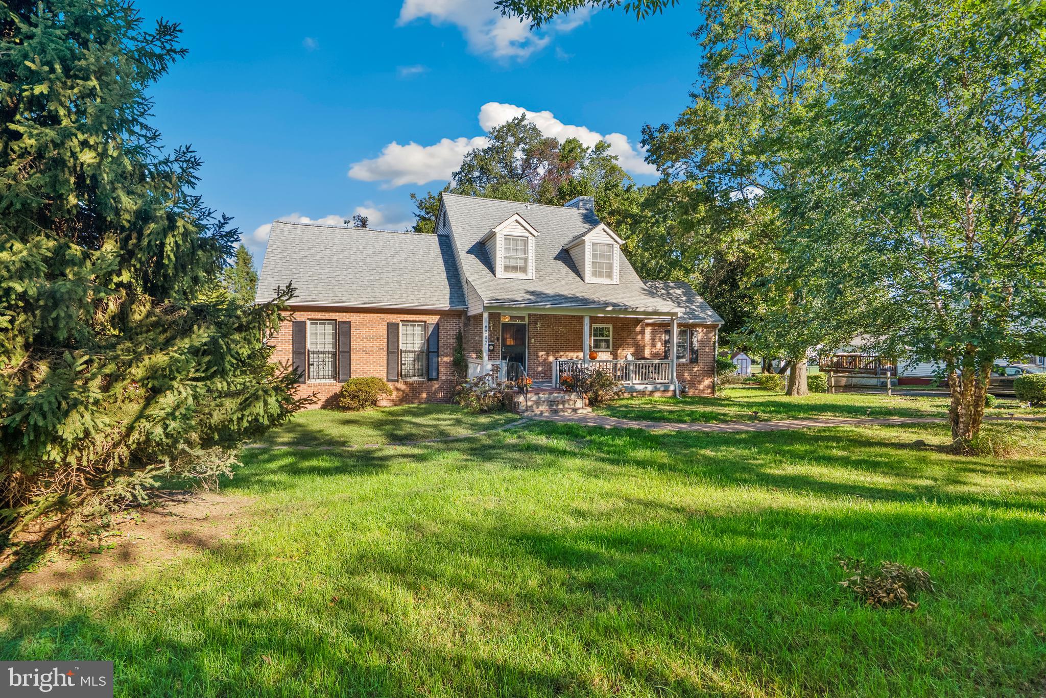 6202 State Street Cheverly, MD 20785 - Photo 1 of 34 a front view of a house with a garden