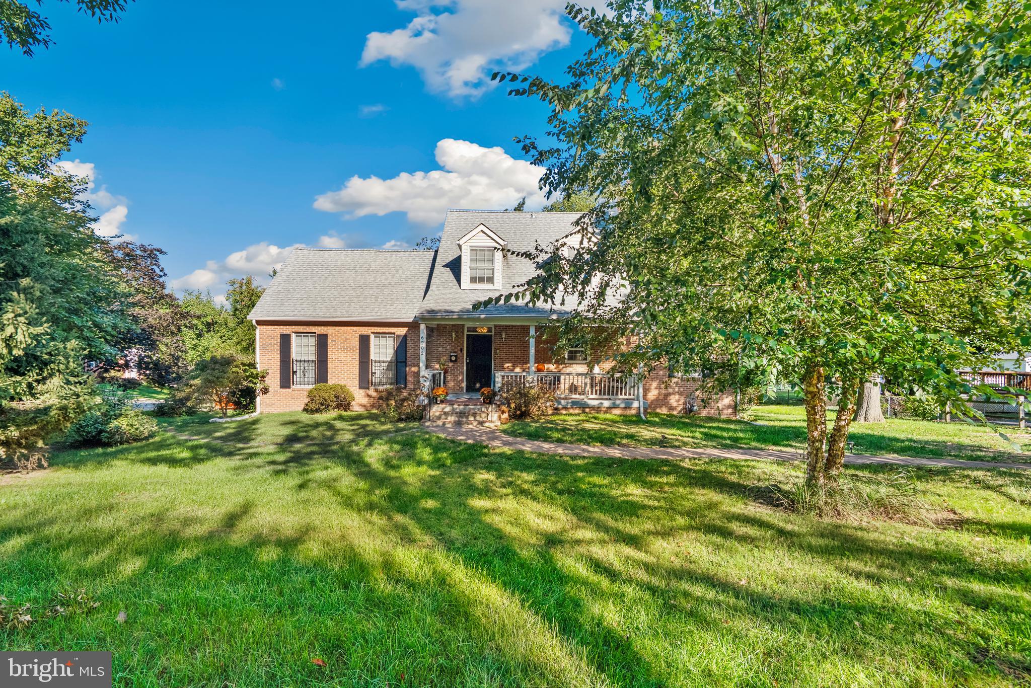 6202 State Street Cheverly, MD 20785 - Photo 2 of 34 a front view of a house with a yard table and chairs