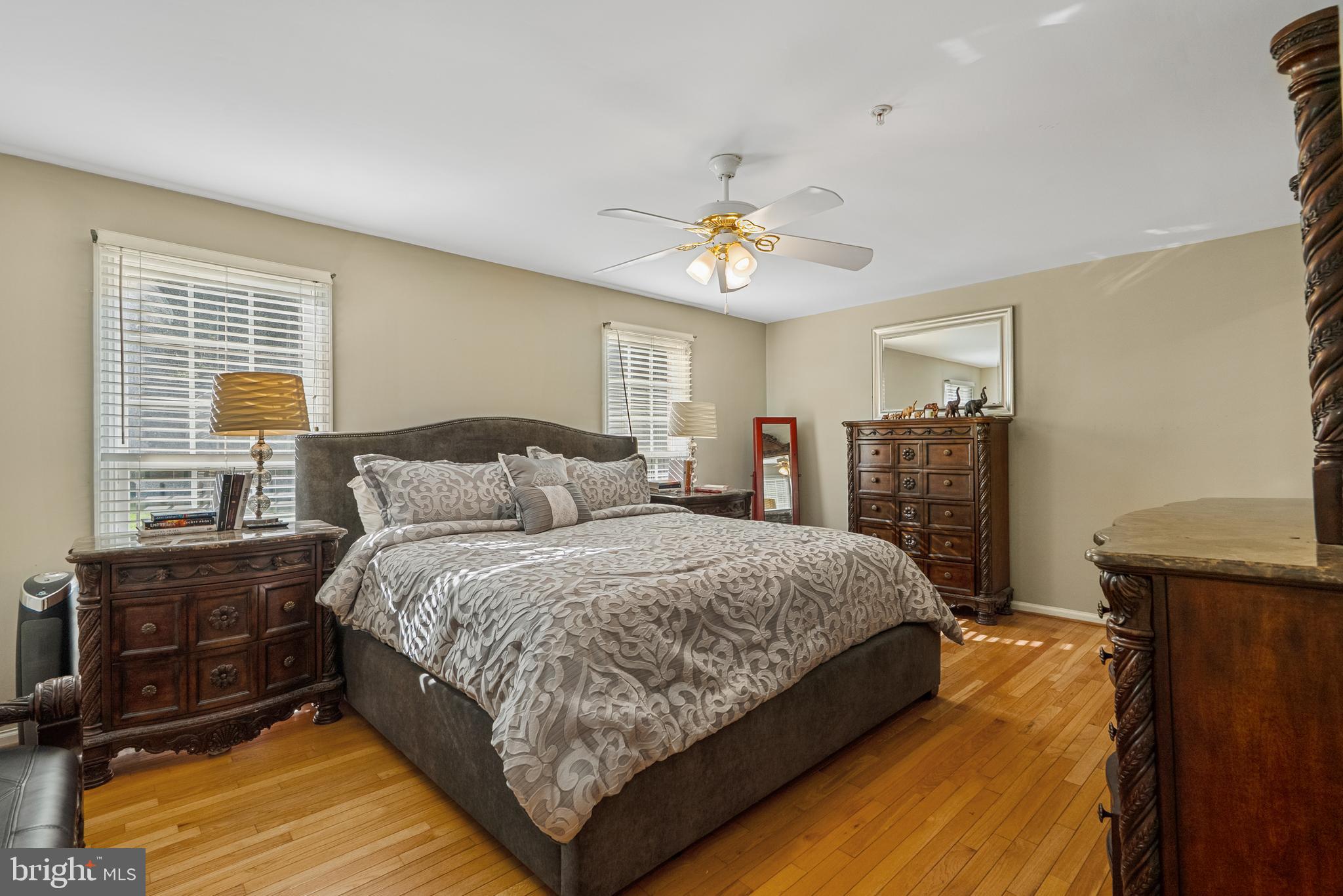 6202 State Street Cheverly, MD 20785 - Photo 25 of 34 a spacious bedroom with a bed and wooden floor
