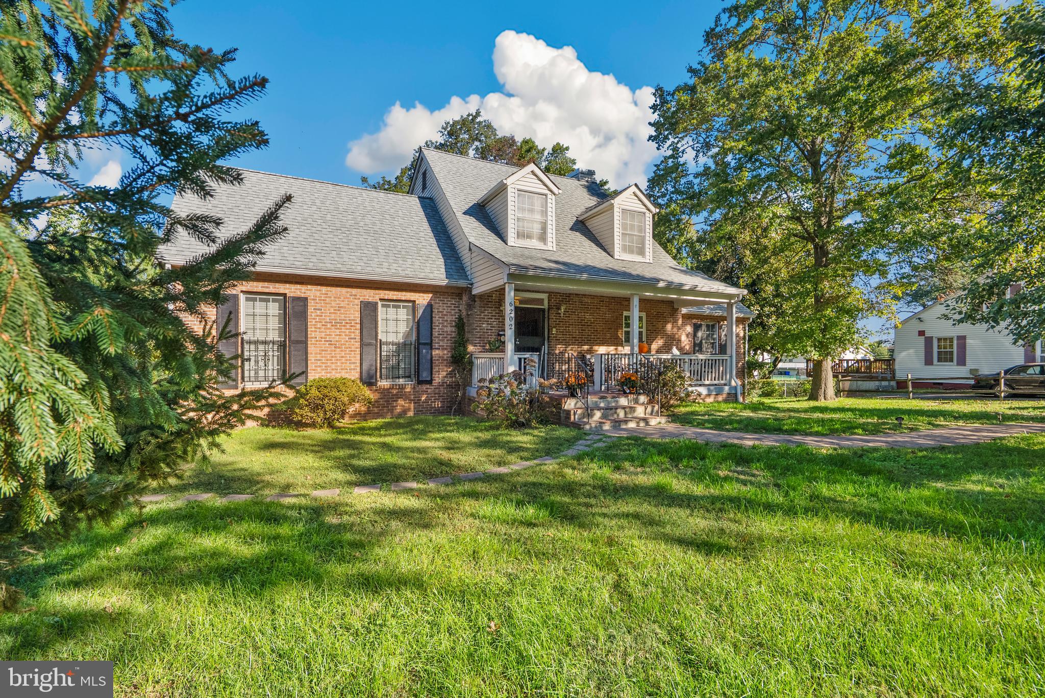 6202 State Street Cheverly, MD 20785 - Photo 3 of 34 a front view of a house with a garden